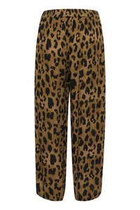 Pantalons en imprimé léopard en tissu doux, avec une taille élastiquée, une coupe ample, et un fond marron parsemé de taches noires.