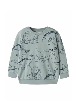 Sweat-shirt enfant vert clair avec motifs de dinosaures en contour bleu foncé, incluant tricératops, stégosaure et ptérodactyle.