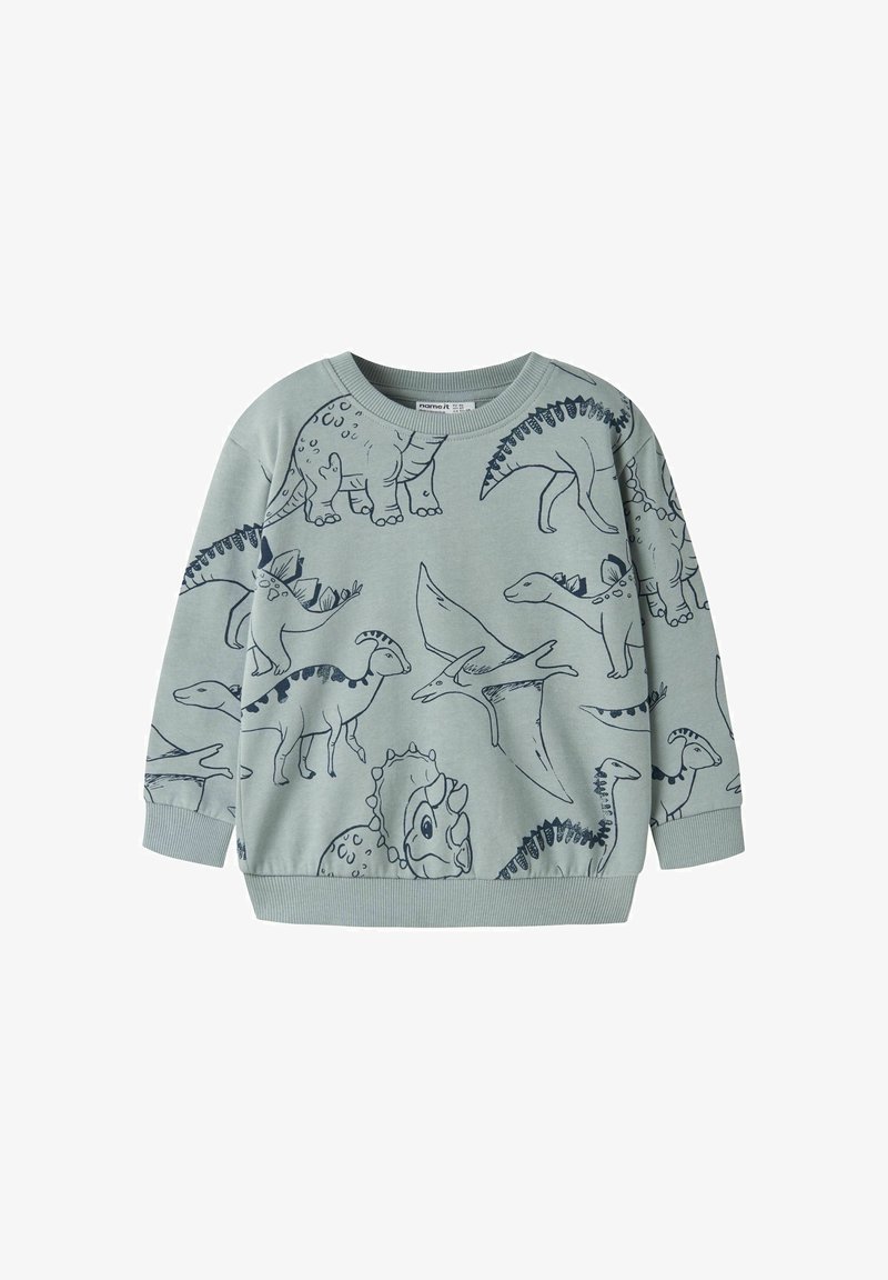 Sweat-shirt enfant vert clair avec motifs de dinosaures en contour bleu foncé, incluant tricératops, stégosaure et ptérodactyle.