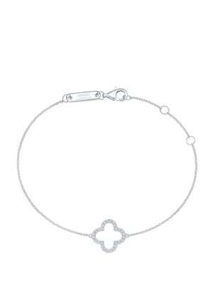 Delicate silver bracelet with a small clover-shaped charm outlined by tiny clear stones and a lobster clasp engraved with Giorgio Martello.