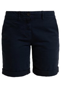 Granatowe bawełniane spodenki z podwiniętym dołem, wyposażone w zapięcie na przód na guziki, zamek błyskawiczny oraz boczne kieszenie. Gładka faktura, casualowy design.