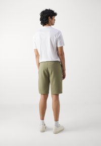 Calvin Klein MICRO LOGO REPREVE - Pantalones deportivos - delta green