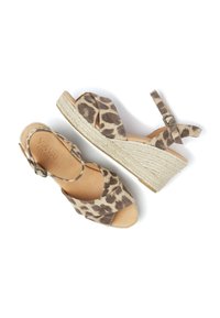 Leopard-print wedge sandals with cross straps and ankle buckle. Crafted in soft suede with a jute-wrapped platform. Beige tone.