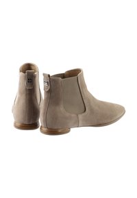 Tan suede ankle boots with elastic side panels, rounded toe, and low wooden heel. Features a small logo tag on the heel and a smooth texture.
