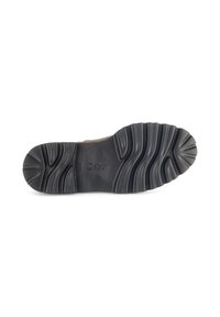 Suela de zapato de goma negra con surcos profundos para tracción. Presenta un logo en relieve "Gabor" y patrones de tracción en capas para estabilidad.