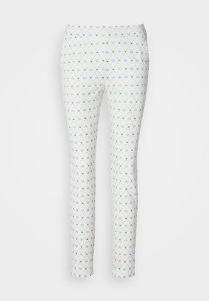 Slim-fit trousers in white fabric featuring a geometric pattern of blue hearts and green accents. Smooth texture, ankle-length design.