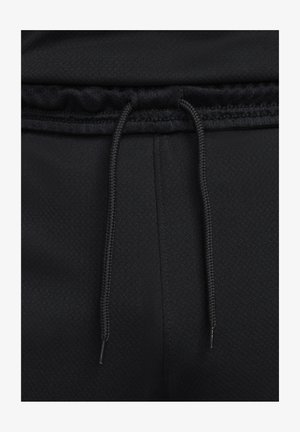 Zwarte sportbroek van een gestructureerde stof, met een elastische tailleband en een trekkoord met metalen aglets voor een verstelbare pasvorm.