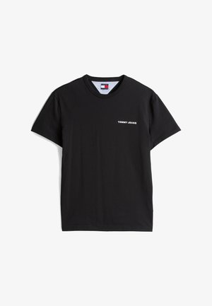 T-shirt de algodão preto com decote redondo e mangas curtas. Apresenta o texto branco "TOMMY JEANS" na parte da frente. Textura suave e lisa.