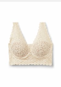 Lace bra in light beige with scalloped edges, featuring intricate floral patterns and padded cups for shaping.