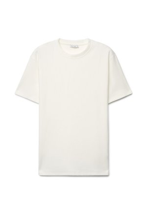 T-shirt blanc uni à manches courtes avec col rond, posé à plat sur un fond blanc.
