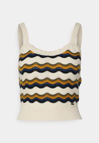 Pletený crop top v krémové barvě s vlnitými pruhy v námořnické modré, olivové, zlaté a černé. Má úzké ramínka a přiléhavý pas.