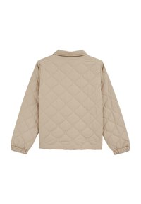 Beige takki, joka on vuorattu ja jossa on kaulus, pitkät hihat ja joustavat hihansuut. Tekstiilissä on teksturoitu timanttimallinen kuvio.