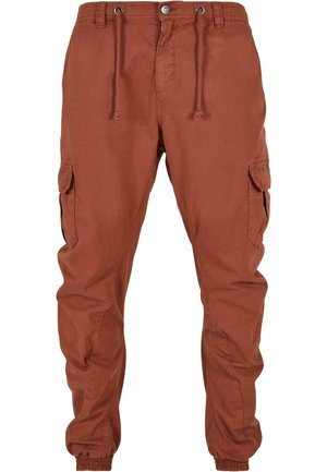 Cargo-bukser i rustfarge, laget av lett stoff. Funksjoner inkluderer elastiske mansjetter, snøring i livet og sidelommer med klaffer.