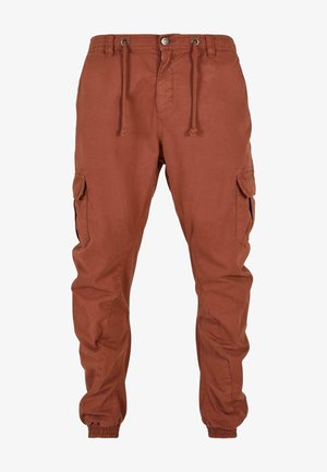 Cargo nohavice v rustikálnej farbe, vyrobené z ľahkej tkaniny. Medzi funkcie patrí elastické manžety, sťahovacia šnúrka v páse a bočné vrecká s klopami.