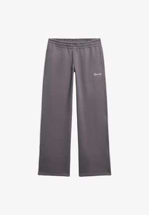 Pantalons de jogging gris avec une coupe décontractée et jambes larges. Comprend une taille élastique, des poches latérales et une couture décorative blanche.
