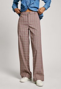  rutiga byxor i nyanser av brunt och rött, med en vid ben design, hög midja och knappstängning. Materialet har en slät textur.