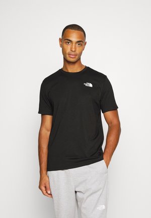 FOUNDATION GRAPHIC TEE - Sports T-shirt - black/cone orange