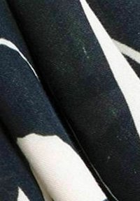 Material abstract cu un fundal bleumarin, având forme organice mari de culoare albă. Materialul pare texturat, având un ușor luciu.