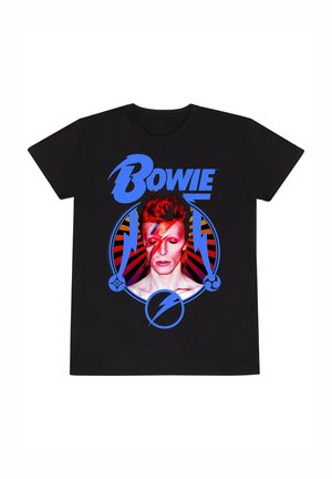 T-shirt noir présentant un design graphique d'une personne avec des cheveux roux et du maquillage facial. Le texte "Bowie" est en bleu, avec des accents circulaires.