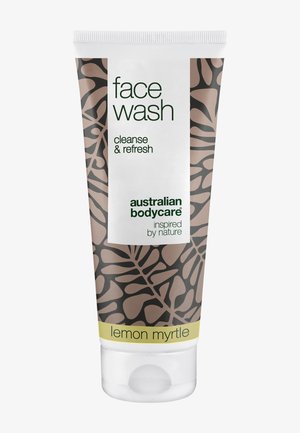 Tube of face wash featuring a brown patterned design with a white label. Text includes "cleanse & refresh" and "lemon myrtle" in green and yellow.