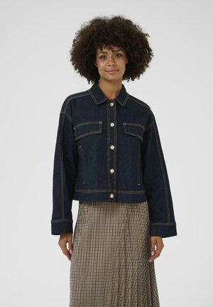 Dark blue denim jacket with gold buttons, two chest pockets, and visible stitching. Relaxed, cropped design with long sleeves.
