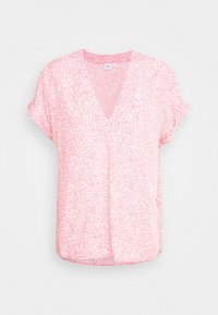 Rosa Kurzarmshirt mit V-Ausschnitt, das ein verstreutes weißes Muster zeigt. Leichter Stoff, lockere Passform mit leicht abgerundetem Saum.