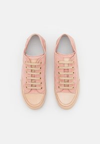 Pink suede sneakers with gold eyelets and beige accents. Rounded toe, flat sole, and lacing system without a visible tongue.
