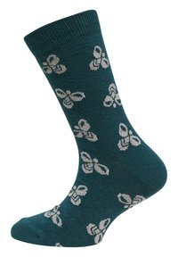 Teal sokker lavet af blødt stof med ribbet manchet; prydet med et subtilt hvidt mønster af blomsterformer over det hele.