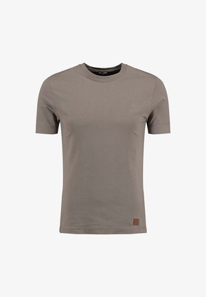 Bruine katoenen t-shirt met een ronde hals, korte mouwen en een subtiele logo op de borst. Heeft een klein leren label aan de zijkant.