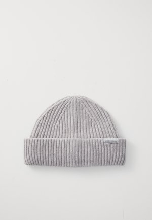Gray knitted beanie with a ribbed texture, featuring a folded cuff and a small brand label on the side.