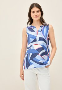 Top senza maniche in diverse tonalità di blu, caratterizzato da un motivo ondulato con accenti rossi. Tessuto texturizzato con scollatura a V e vestibilità rilassata.