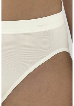 Biancheria intima leggera color crema con una superficie liscia, caratterizzata da una cintura morbida e un branding minimale per un aspetto pulito.