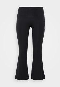 Fekete, harangszoknyás leggings rugalmas anyagból, magas derékkal, bal csípőn egy apró fehér logóval.