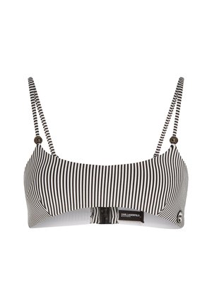 Top bikini a righe bianche e nere con spalline regolabili, chiusura a gancio e dettaglio del logo. Tessuto liscio con una silhouette strutturata.