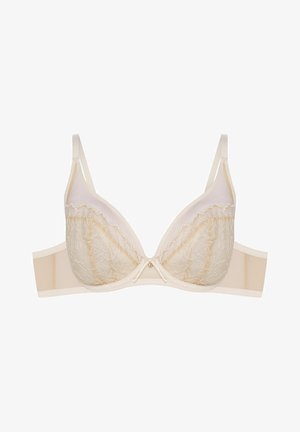 Beżowy biustonosz koronkowy z miękkimi miseczkami, kwiatowym haftem i gładką taśmą z tyłu. Regulowane ramiączka i centralna kokardka podkreślają design.