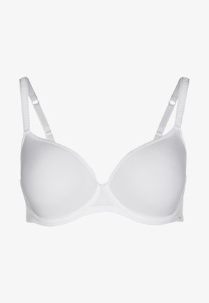 Bílá podprsenka s polstrováním, nastavitelnými ramínky, hladkým povrchem a bezšvým designem. Hladké košíčky a jednoduché zapínání na háček na zadní straně.