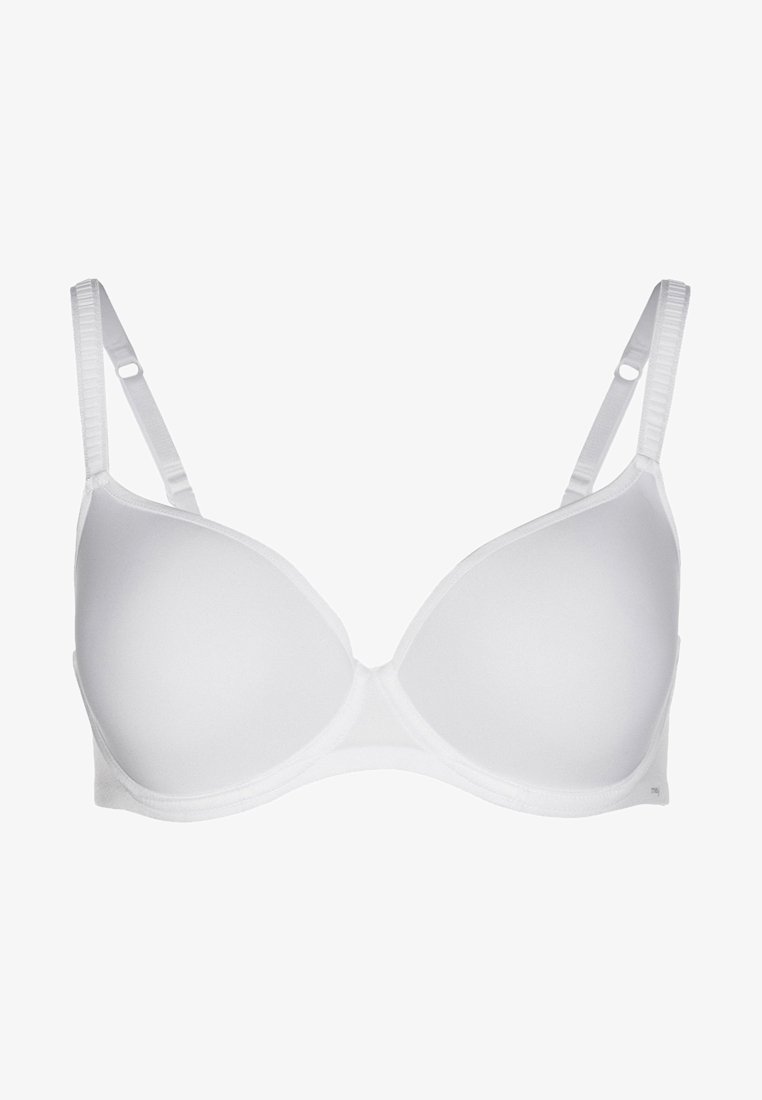 Valkoinen pehmustettu rintaliivi, jossa on säädettävät hihnat, sileä pinta ja saumaton muotoilu. Ilman erityispiirteitä olevat kupit ja yksinkertainen hakasuljenta takana.