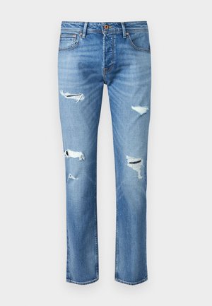 Lichtblauwe denim jeans met een rechte pijp, voorzien van meerdere versleten gebieden en rafeldetails op de knieën. Koperkleurige accenten.