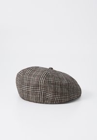 Tweed beret in gray with black, white, and red houndstooth pattern. Rounded crown and a small top button detail. Soft texture.