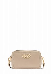 Beige leather crossbody bag with a gold logo, zip closure, rectangular shape, and a detachable shoulder strap. Smooth texture, minimalistic design.