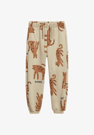 Beige Baumwoll-Jogginghosen mit einem verspielten Druck von stilisierten braunen Katzen mit schwarzen Punkten und dem Schriftzug "CHOOSE" in Blau. Elastischer Bund.