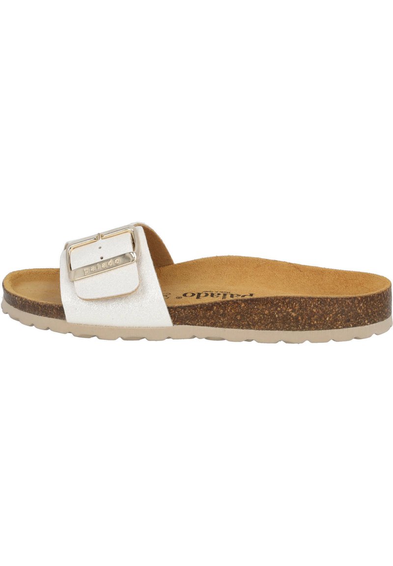 White slide sandal with a textured strap and large metallic buckle. Cork footbed and a light rubber sole. Flat design for ease of wear.