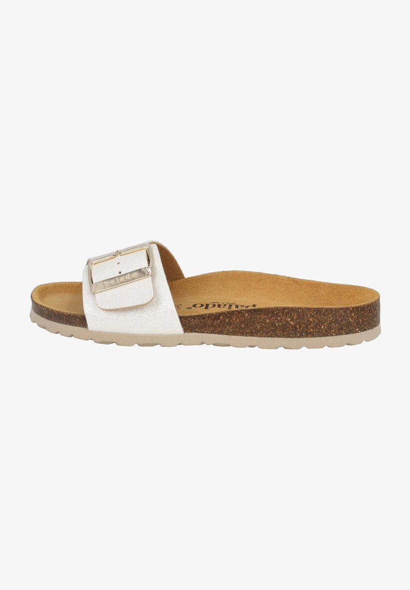 White slide sandal with a textured strap and large metallic buckle. Cork footbed and a light rubber sole. Flat design for ease of wear.