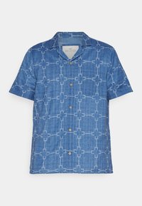 Košile s krátkým rukávem v jemné modré džínovině s mřížkovým vzorem vytvořeným bílými tečkami a dřevěnými knoflíky. Má klasický límec.