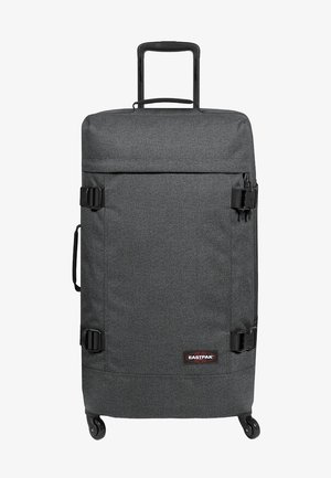 Gray fabric suitcase with a retractable handle, two wheels, and side handles. Features buckle straps and a logo patch on the front.