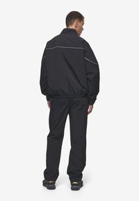 Pegador MERCER TRACK JACKET - Regnjakke - black