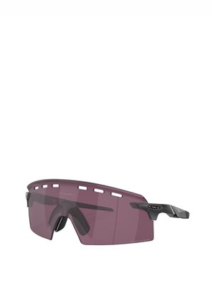 Occhiali da sole sportivi con una grande lente curva di colore viola traslucido, con dettagli in nero opaco e fori di ventilazione sulla parte superiore della montatura.