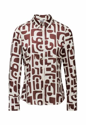 Chemise à manches longues crème avec motifs géométriques abstraits marron, dotée d'un col et d'une patte de boutonnage à l'avant. Tissu lisse et léger.