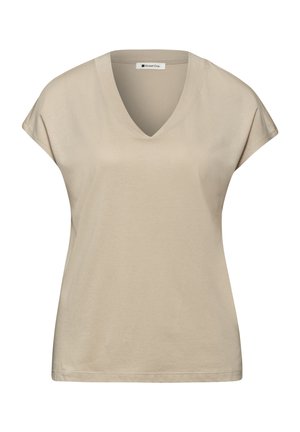 T-shirt beige à manches courtes pour femmes, col en V, coupe décontractée, avec étiquette de la marque Street One à l'intérieur du col.