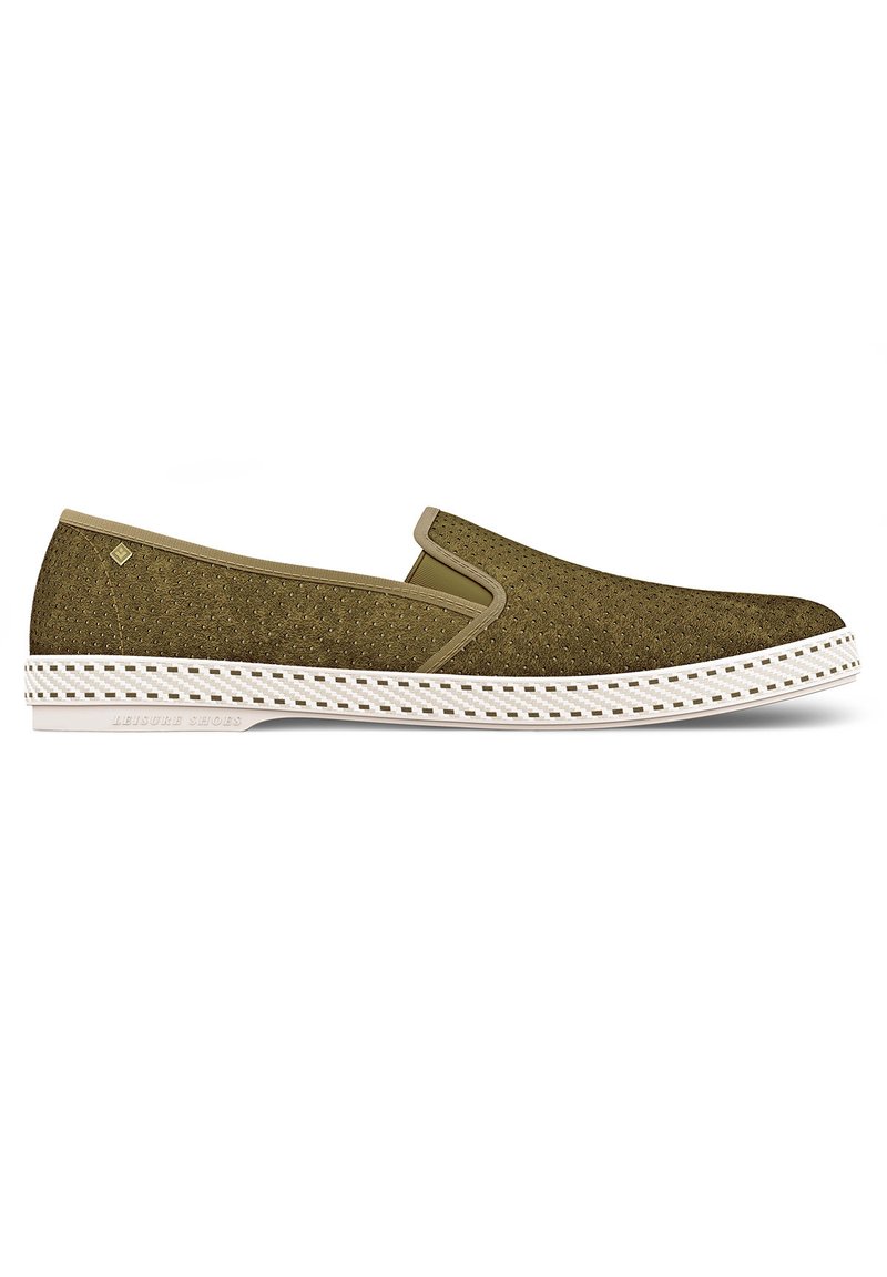 Olive green slip-on shoe with textured upper, elastic side accents, and white rubber sole featuring a patterned edge.
